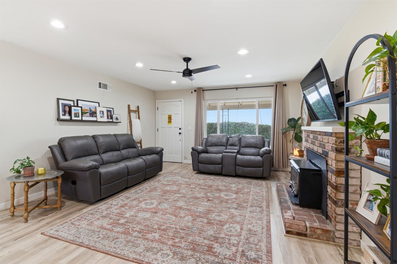 15581 French Camp Road Ripon, CA 95366 - Photo 10 of 54 a living room with furniture and a fireplace