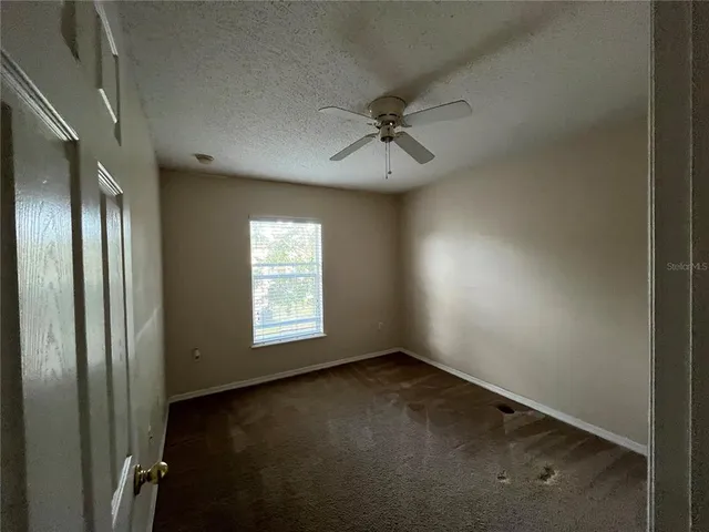 a view of empty room with windows