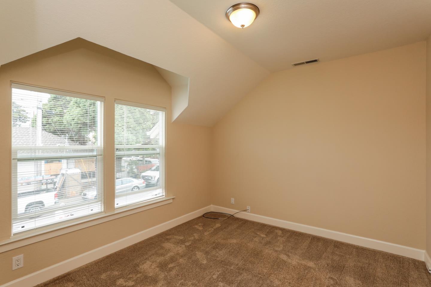 111 Fairview Avenue Capitola, CA 95010 - Photo 18 of 29 an empty room with a window
