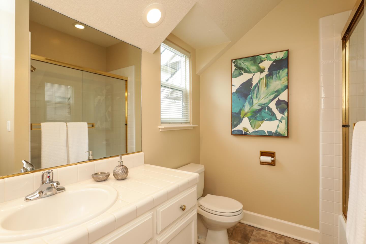 111 Fairview Avenue Capitola, CA 95010 - Photo 20 of 29 a bathroom with a sink a toilet and a mirror