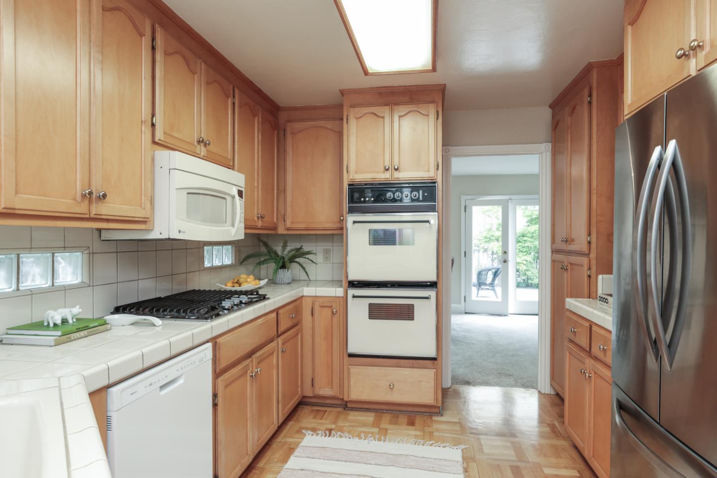 111 Fairview Avenue Capitola, CA 95010 - Photo 7 of 29 a kitchen with stainless steel appliances granite countertop a refrigerator sink and stove