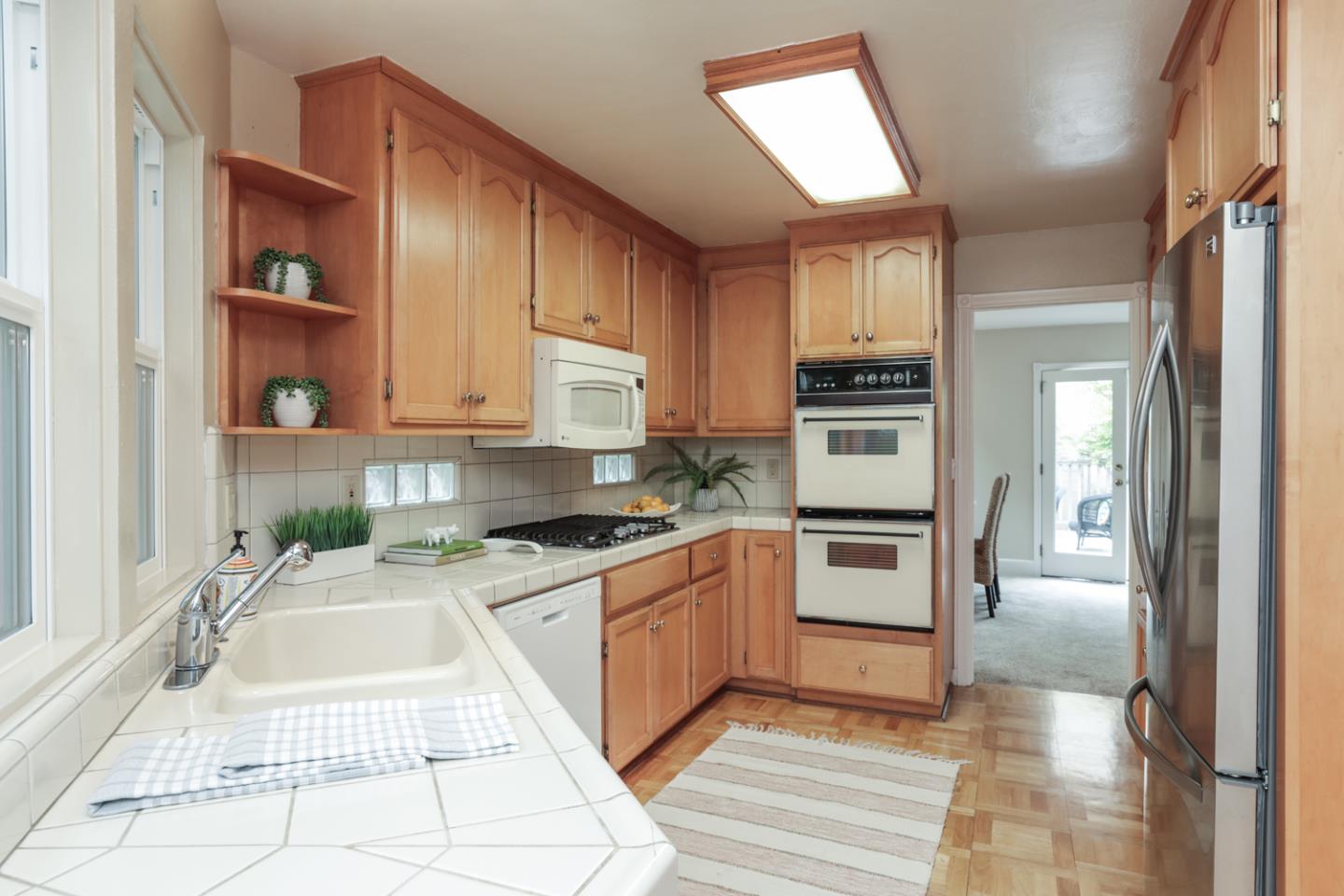 111 Fairview Avenue Capitola, CA 95010 - Photo 9 of 29 a kitchen with stainless steel appliances granite countertop a stove a sink and a refrigerator