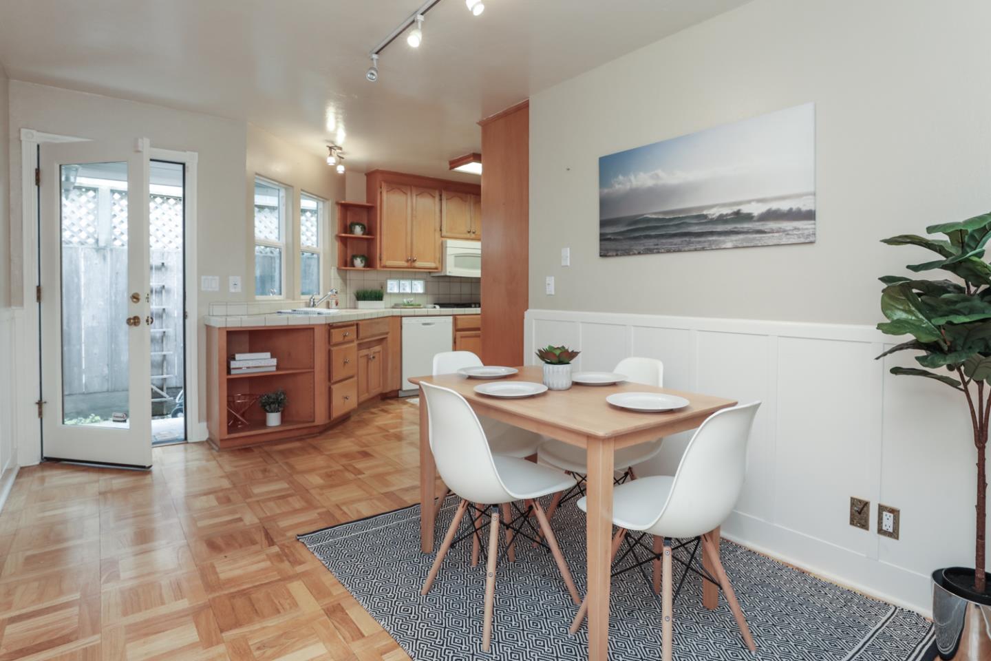 111 Fairview Avenue Capitola, CA 95010 - Photo 10 of 29 a view of a dining room with furniture and wooden floor