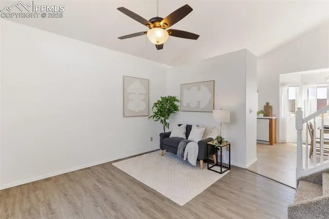 a view of kitchen with furniture and a potted plant