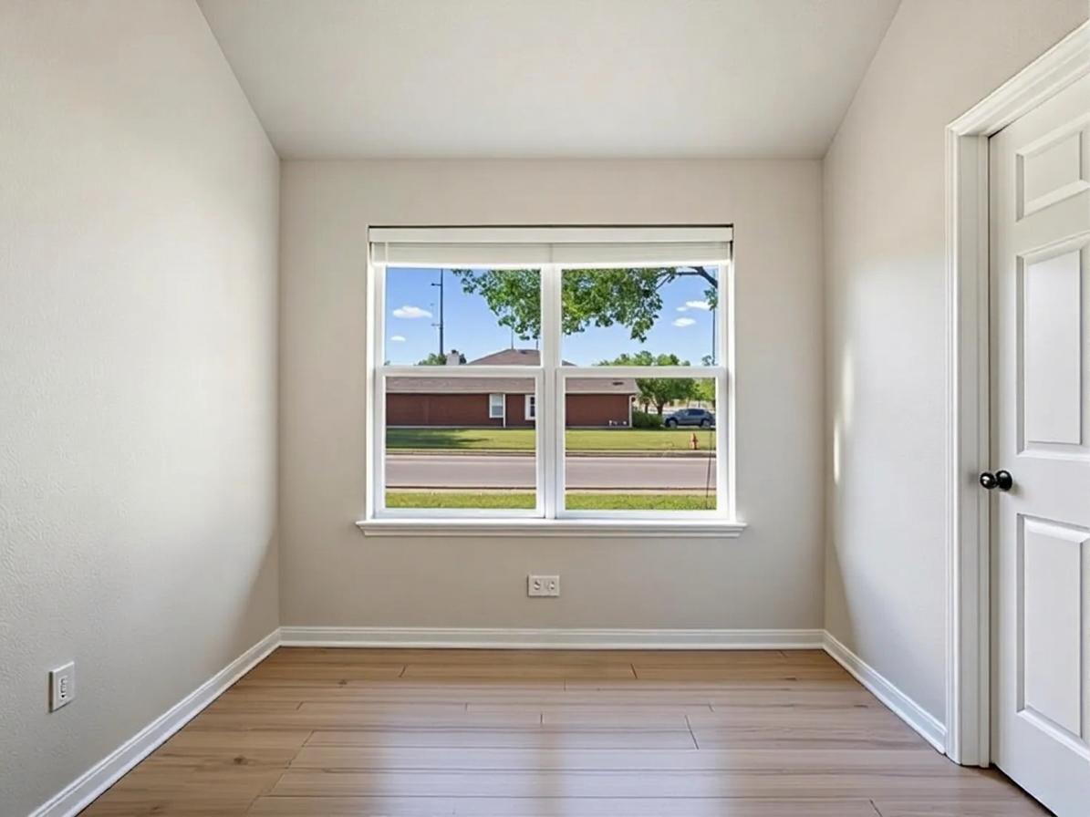 1201 Ridgewood Drive Leander, TX 78641 - Photo 13 of 29 Spare room with baseboards and light wood-style floors