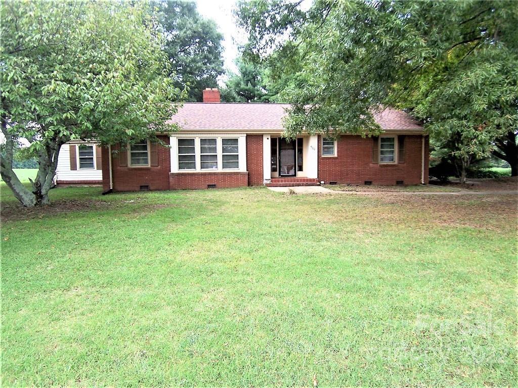 4529 Fallston Road Lawndale, NC 28090 - Photo 1 of 38 a front view of a house with a garden