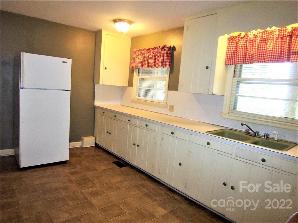 4529 Fallston Road Lawndale, NC 28090 - Photo 14 of 38 a kitchen with a sink and a refrigerator