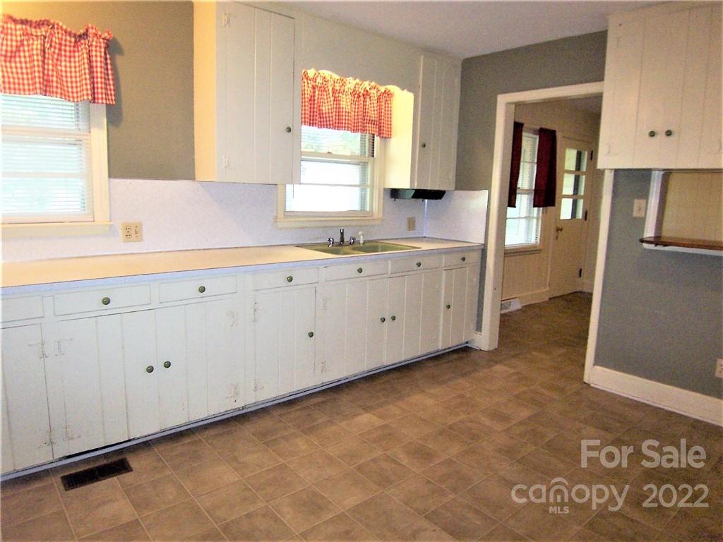 4529 Fallston Road Lawndale, NC 28090 - Photo 15 of 38 a bathroom with a granite countertop sink and a window