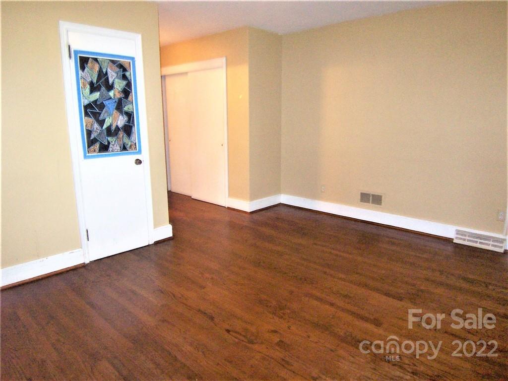 4529 Fallston Road Lawndale, NC 28090 - Photo 19 of 38 an empty room with wooden floor and window