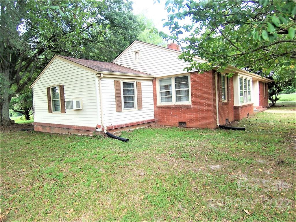 4529 Fallston Road Lawndale, NC 28090 - Photo 2 of 38 a backyard of a house with lots of green space