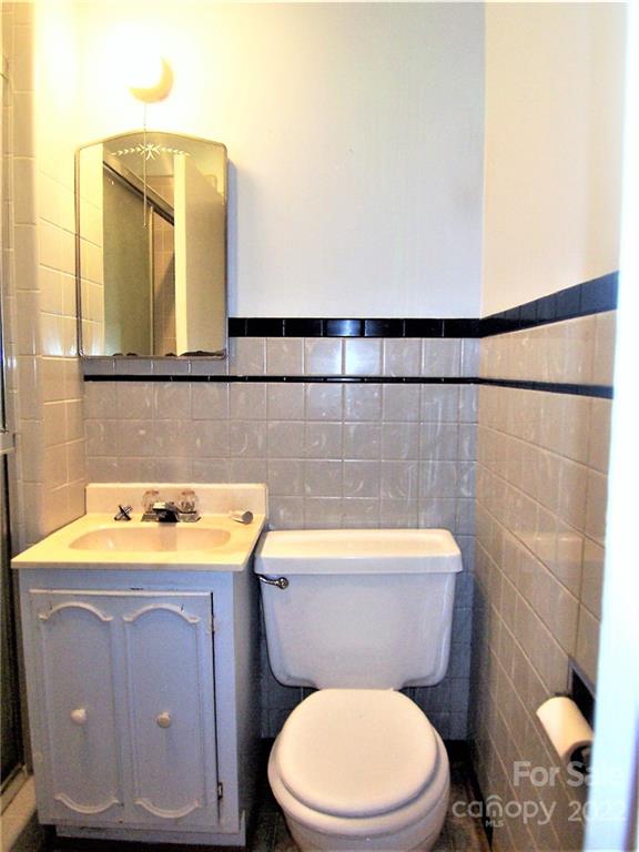 4529 Fallston Road Lawndale, NC 28090 - Photo 26 of 38 a bathroom with a sink a toilet and mirror