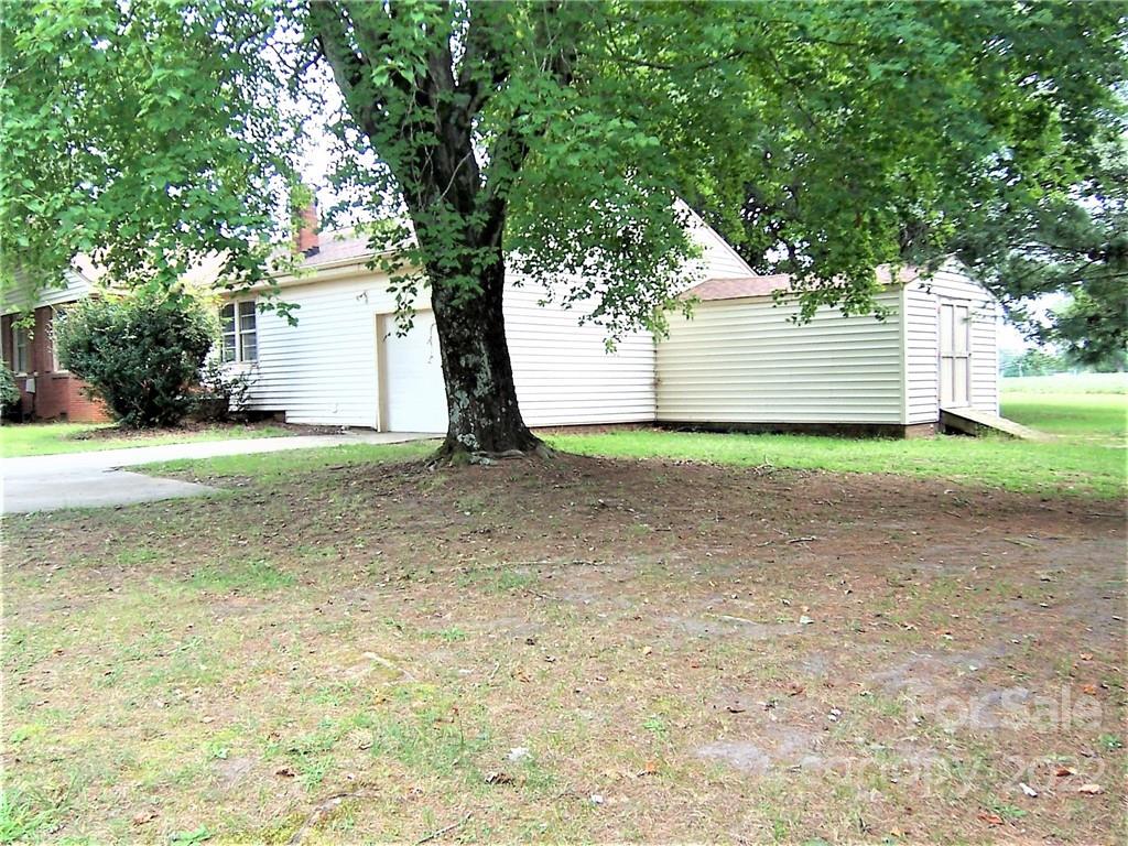 4529 Fallston Road Lawndale, NC 28090 - Photo 30 of 38 a view of a tree in front of a white house