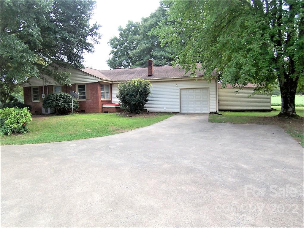 4529 Fallston Road Lawndale, NC 28090 - Photo 31 of 38 a view of a house with a yard and large trees