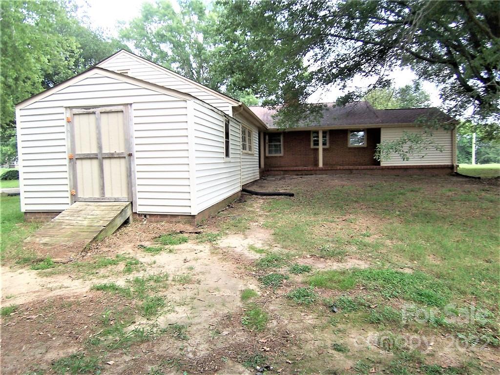 4529 Fallston Road Lawndale, NC 28090 - Photo 32 of 38 a view of a house with a yard and large tree