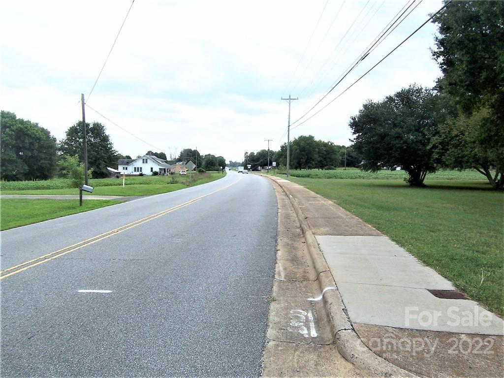 4529 Fallston Road Lawndale, NC 28090 - Photo 37 of 38 a view of a road with a big yard and palm trees