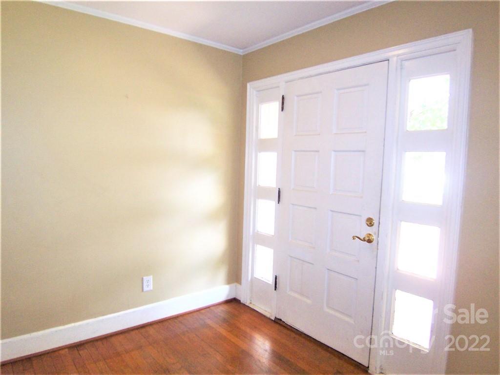4529 Fallston Road Lawndale, NC 28090 - Photo 5 of 38 an empty room with wooden floor and windows