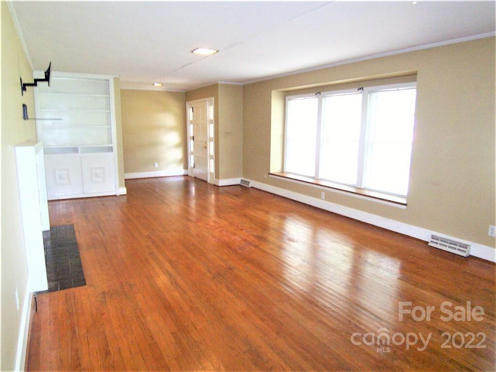 4529 Fallston Road Lawndale, NC 28090 - Photo 9 of 38 a view of an empty room with wooden floor and a window