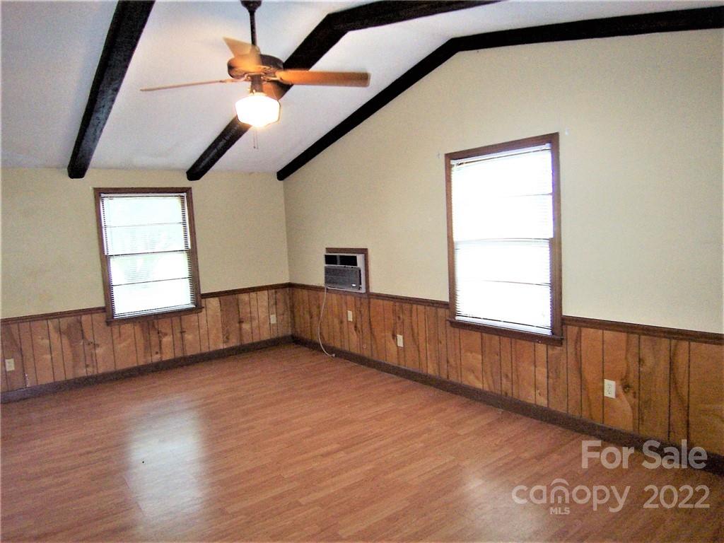 4529 Fallston Road Lawndale, NC 28090 - Photo 10 of 38 an empty room with wooden floor and windows