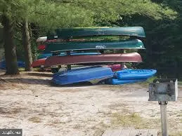 a view of a bench with wooden fence
