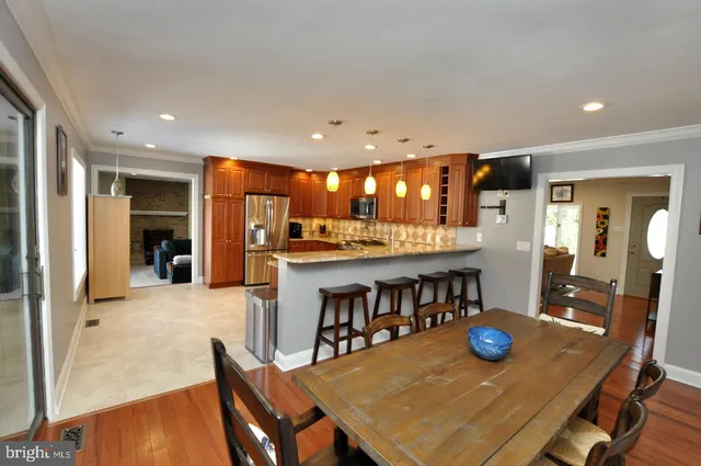 a view of a dining room with furniture and a table