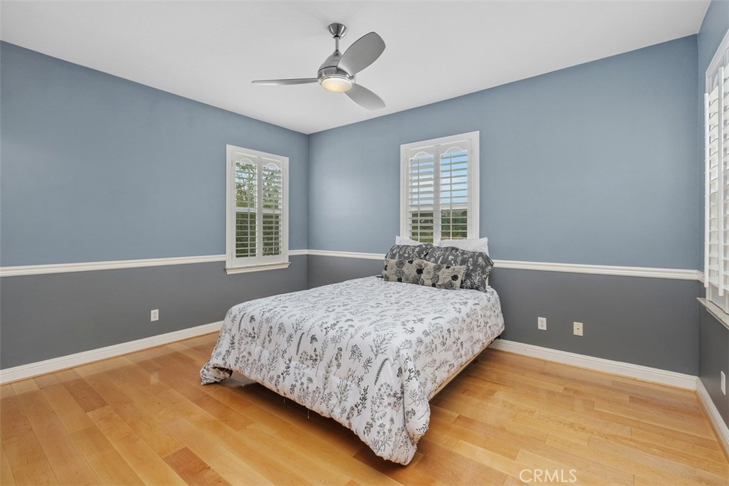 13337 Hunt Club Drive Rancho Cucamonga, CA 91739 - Photo 26 of 45 Upstairs bedroom with ceiling fan and shutters