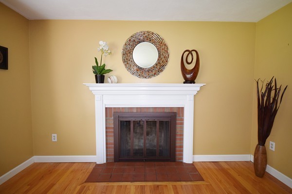 175 Tinkham Road Springfield, MA 01129 - Photo 11 of 30 a view of room with wooden floor and a fireplace