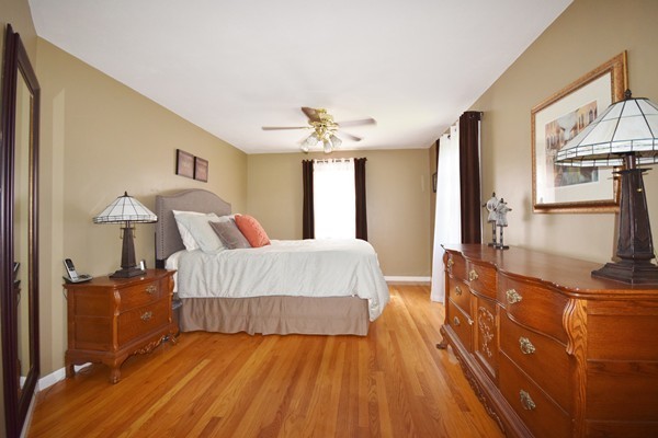175 Tinkham Road Springfield, MA 01129 - Photo 14 of 30 a spacious bedroom with a bed and a chandelier