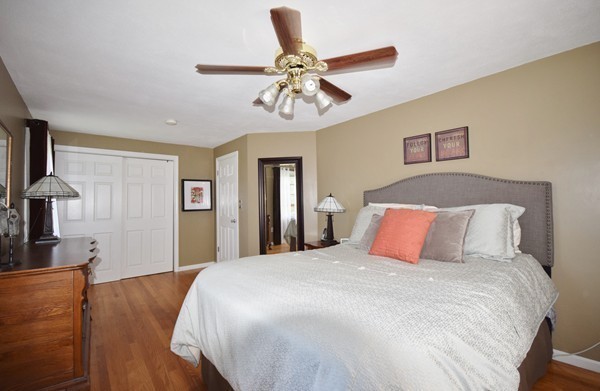 175 Tinkham Road Springfield, MA 01129 - Photo 16 of 30 a bedroom with a bed and a chandelier