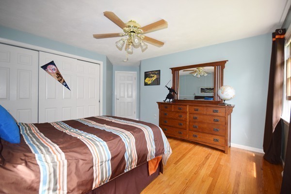175 Tinkham Road Springfield, MA 01129 - Photo 19 of 30 a bedroom with a bed and a dresser in it