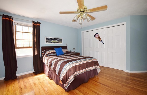 175 Tinkham Road Springfield, MA 01129 - Photo 20 of 30 a bedroom with a bed and a chandelier