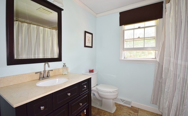 175 Tinkham Road Springfield, MA 01129 - Photo 21 of 30 a bathroom with a sink vanity toilet and a mirror