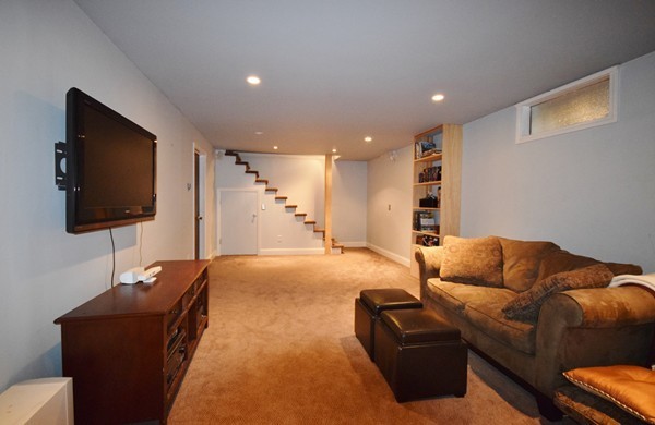 175 Tinkham Road Springfield, MA 01129 - Photo 23 of 30 a living room with furniture and a flat screen tv
