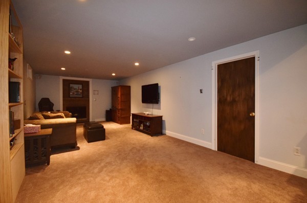 175 Tinkham Road Springfield, MA 01129 - Photo 24 of 30 a living room with furniture a flat screen tv and kitchen view