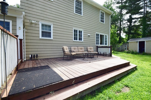 175 Tinkham Road Springfield, MA 01129 - Photo 26 of 30 a view of a wooden deck with chairs and a yard