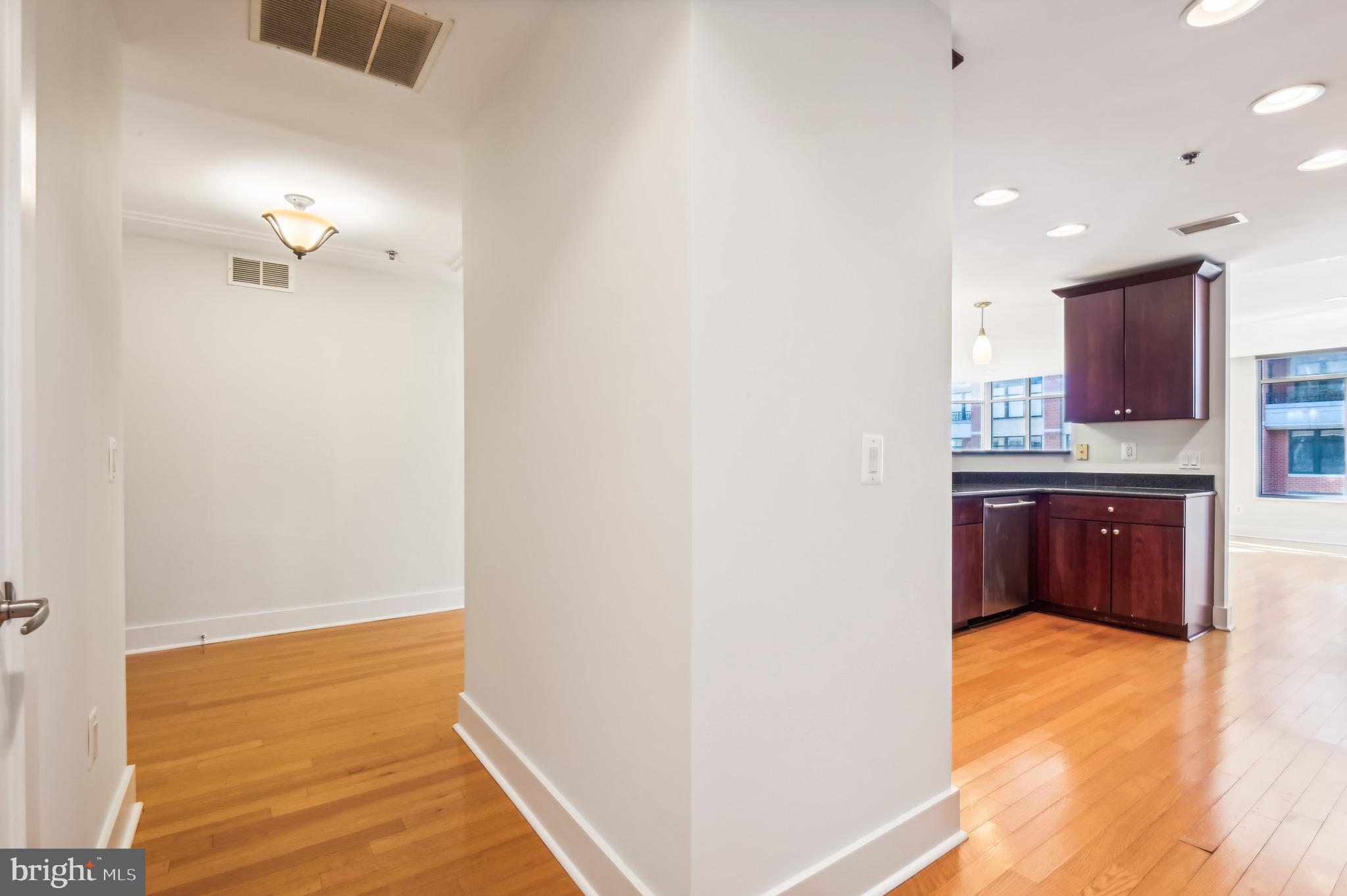 1400 Lancaster Street, Unit 502 Baltimore, MD 21231 - Photo 16 of 48 a bathroom with a sink and a mirror
