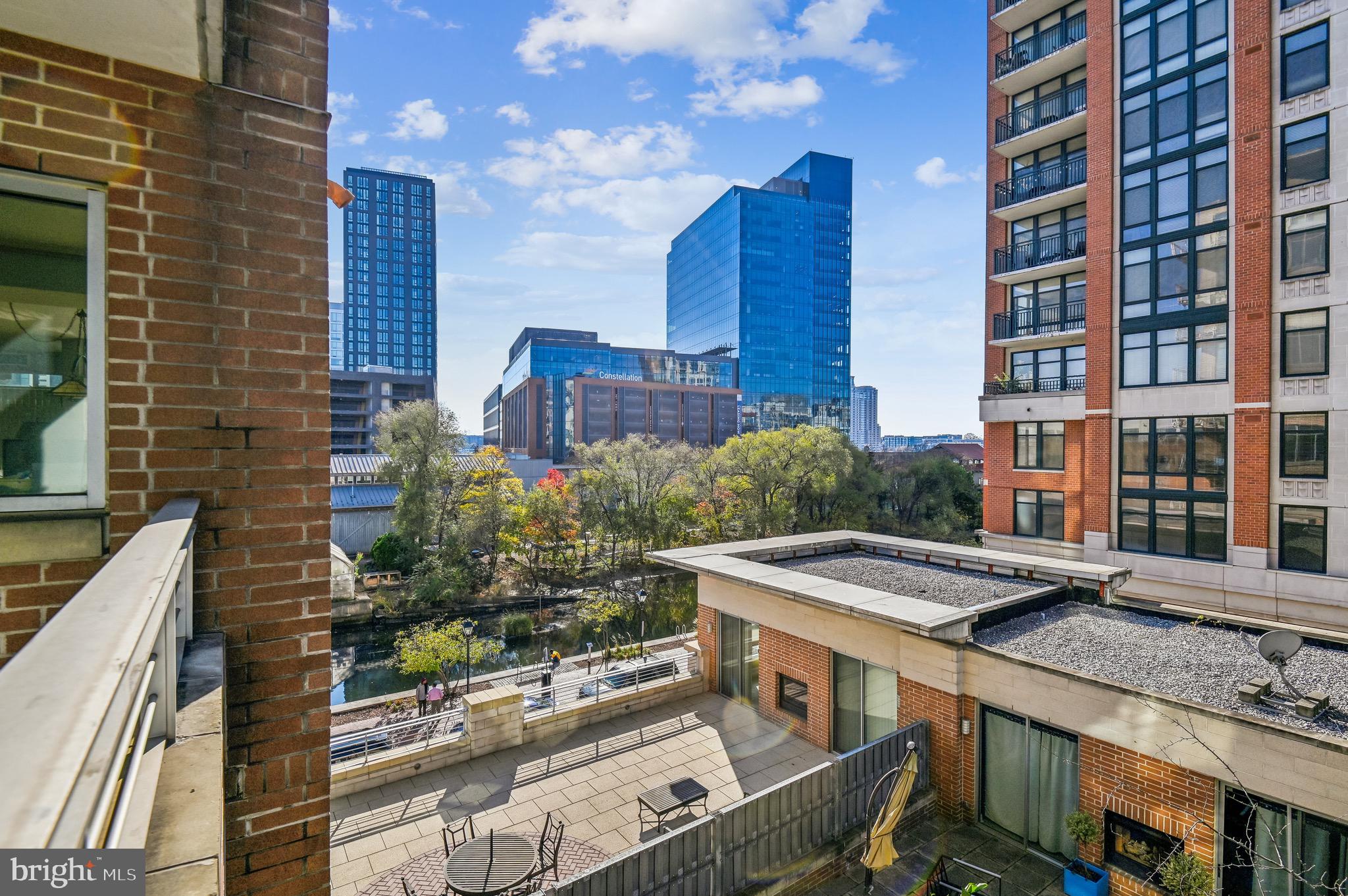 1400 Lancaster Street, Unit 502 Baltimore, MD 21231 - Photo 17 of 48 a view of a brick building next to a yard