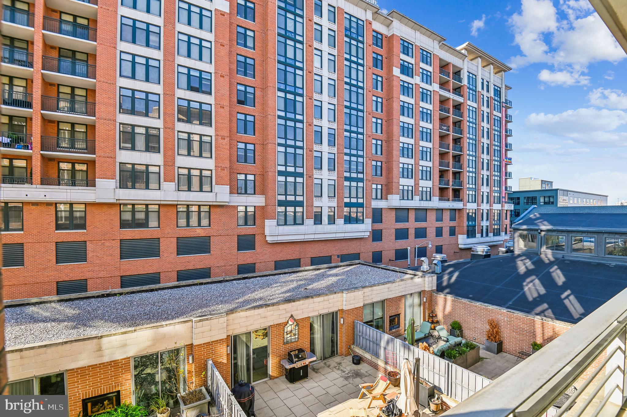 1400 Lancaster Street, Unit 502 Baltimore, MD 21231 - Photo 19 of 48 a front view of a building with glass windows