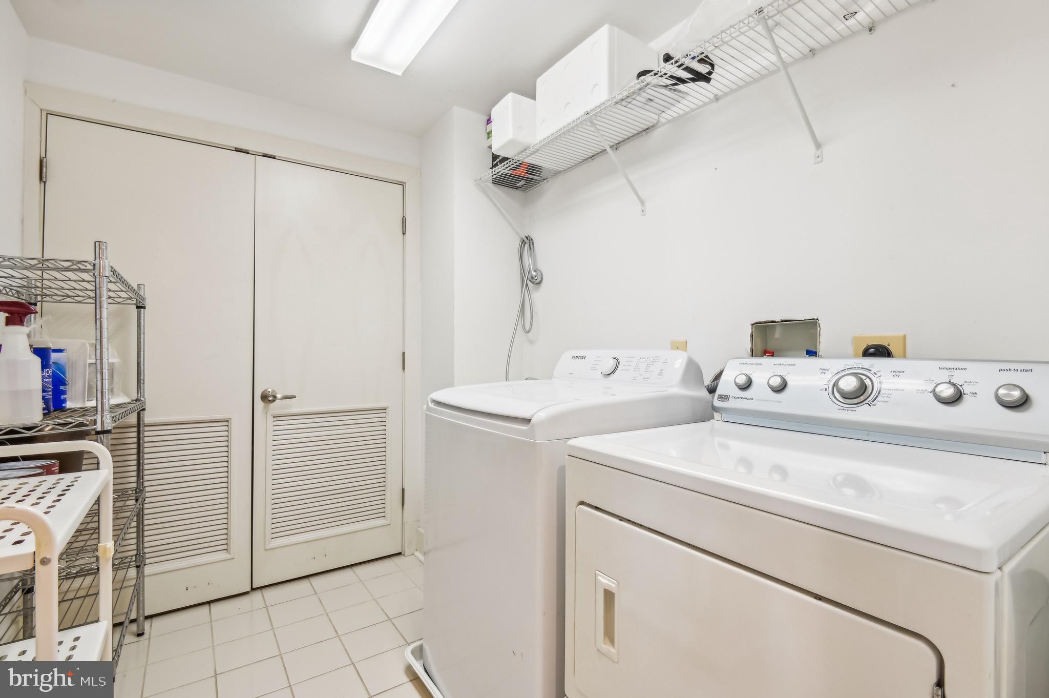 1400 Lancaster Street, Unit 502 Baltimore, MD 21231 - Photo 37 of 48 a utility room with dryer and washer