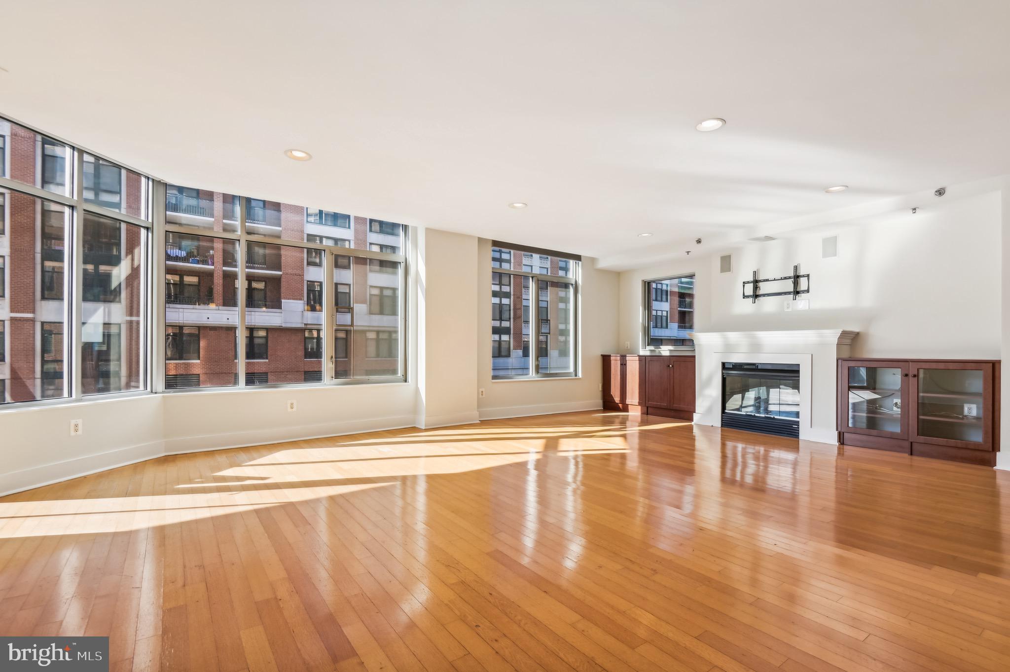 1400 Lancaster Street, Unit 502 Baltimore, MD 21231 - Photo 4 of 48 a living room with furniture and a fireplace