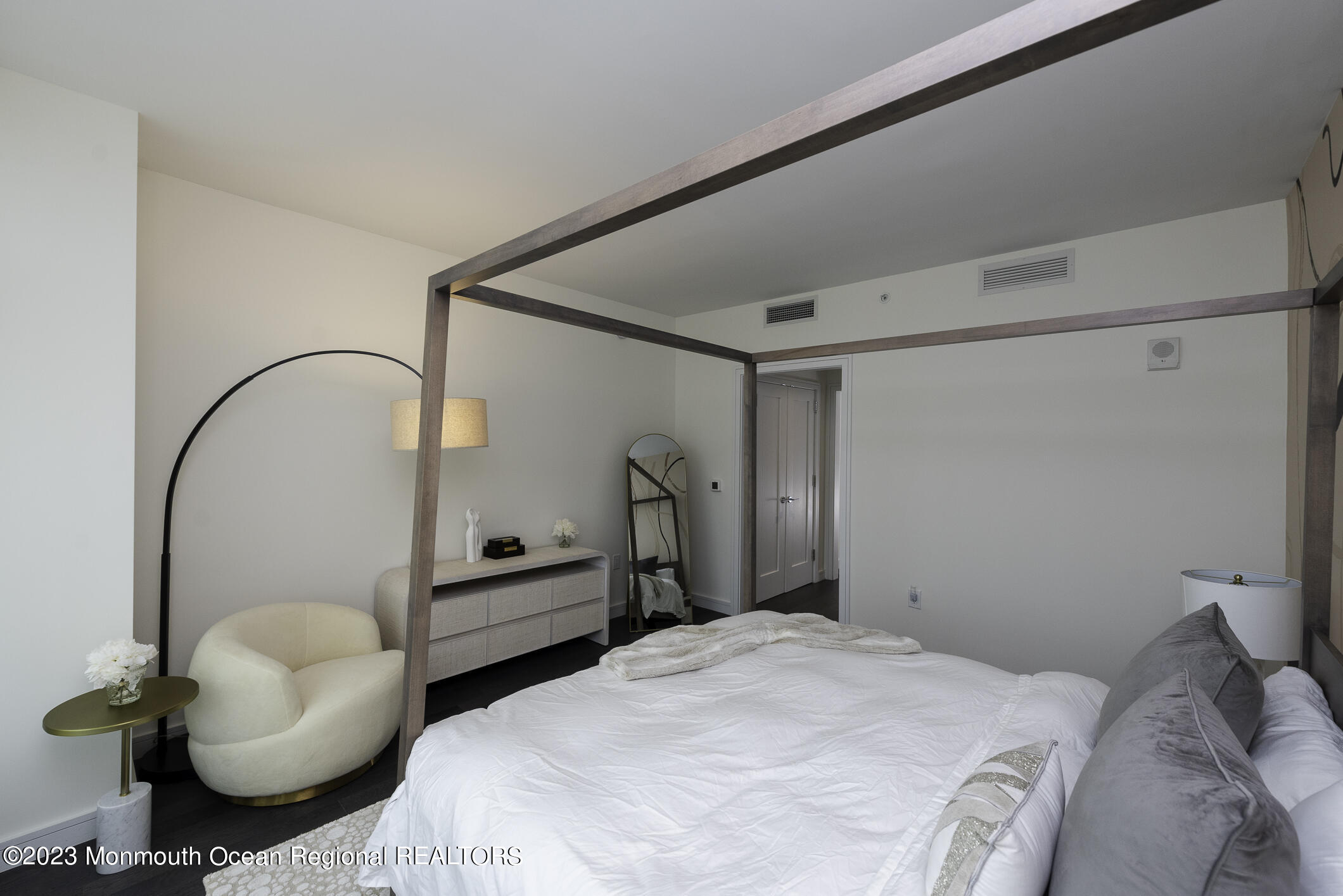 30 Melrose Terrace, Unit 301(WINTER RENTAL) Long Branch, NJ 07740 - Photo 11 of 37 a bedroom with a bed and a chair