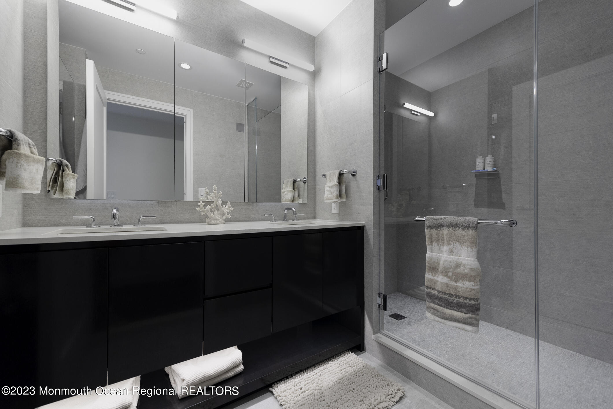 30 Melrose Terrace, Unit 301(WINTER RENTAL) Long Branch, NJ 07740 - Photo 13 of 37 a bathroom with a double vanity sink and mirror
