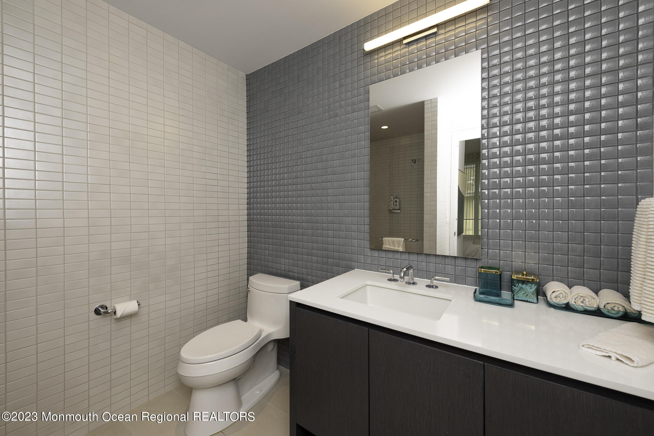 30 Melrose Terrace, Unit 301(WINTER RENTAL) Long Branch, NJ 07740 - Photo 15 of 37 a bathroom with a sink a toilet and shower