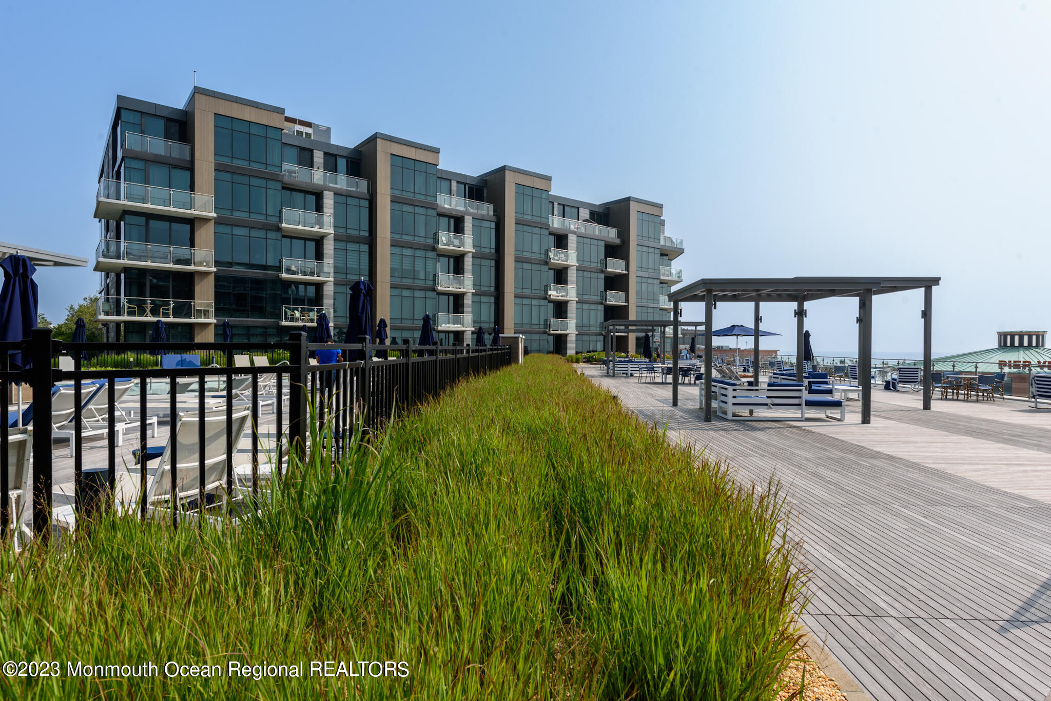 30 Melrose Terrace, Unit 301(WINTER RENTAL) Long Branch, NJ 07740 - Photo 24 of 37 a view of building with garden space