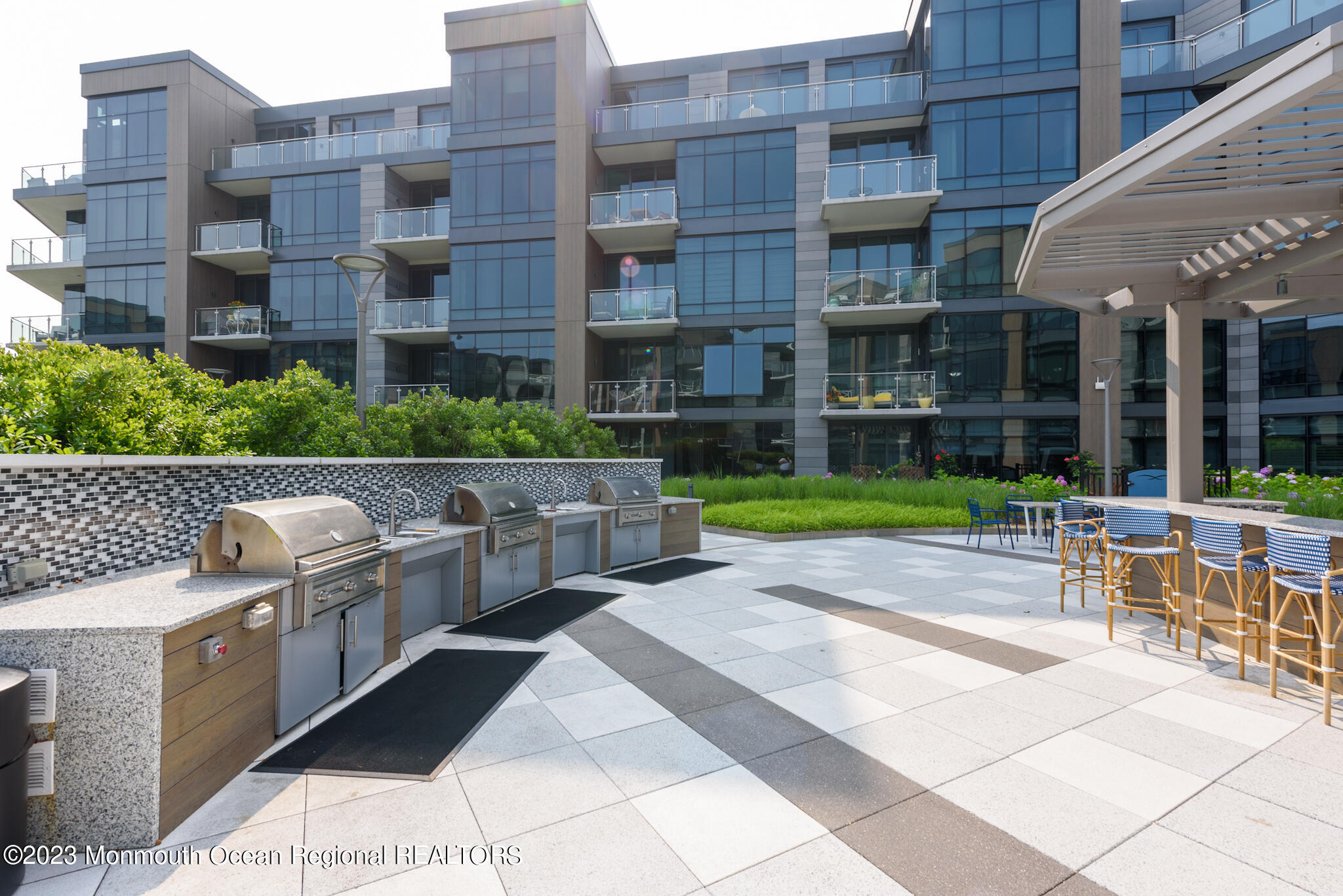30 Melrose Terrace, Unit 301(WINTER RENTAL) Long Branch, NJ 07740 - Photo 25 of 37 a front view of a building with outdoor seating