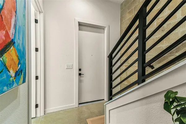 a kitchen with stainless steel appliances granite countertop a sink a stove and a wooden floors