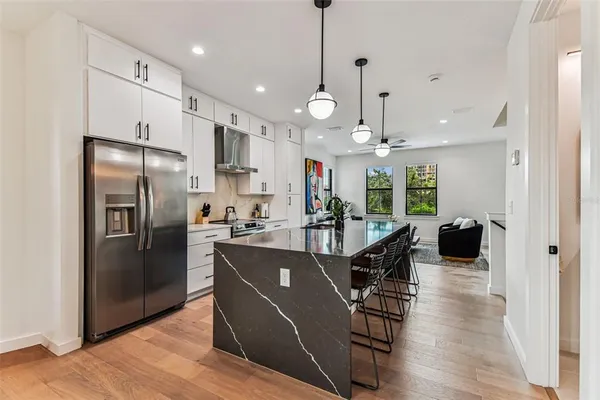 a view of a sink and living room with a sink