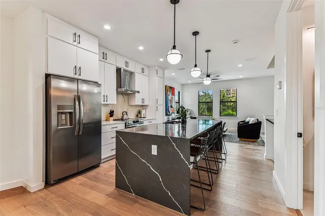 a view of a sink and living room with a sink