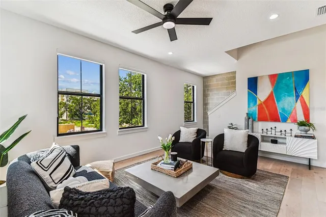 a bathroom with a tub shower and mirror