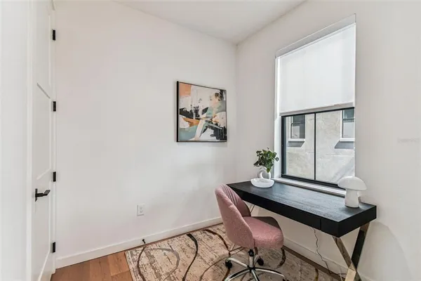 a bedroom with a bed and a sink