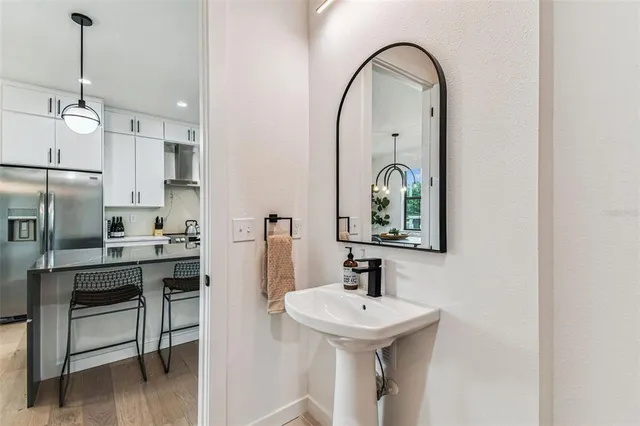 a view of a roof deck with table and chairs